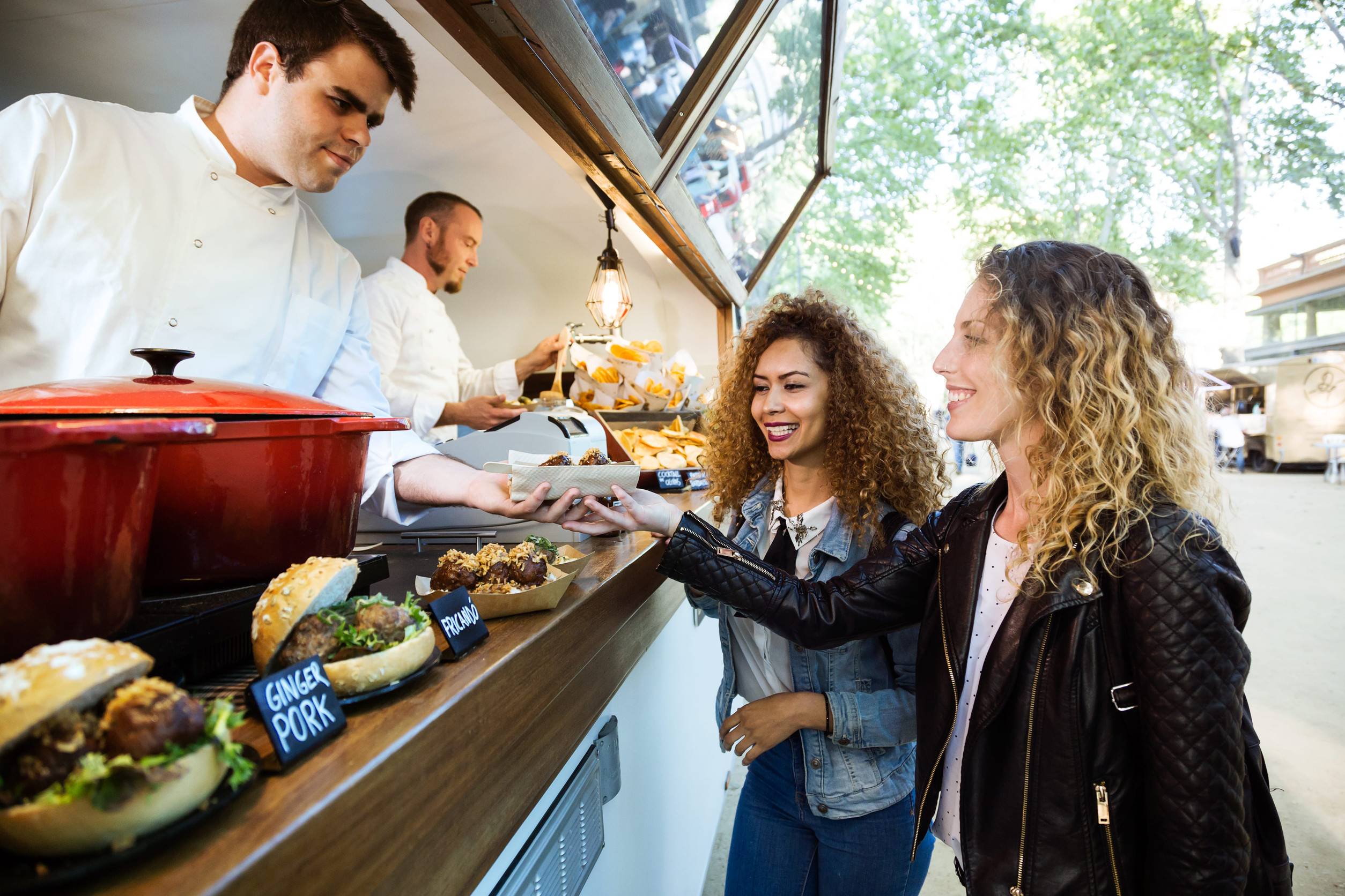 Women Buying Food From A Food Truck