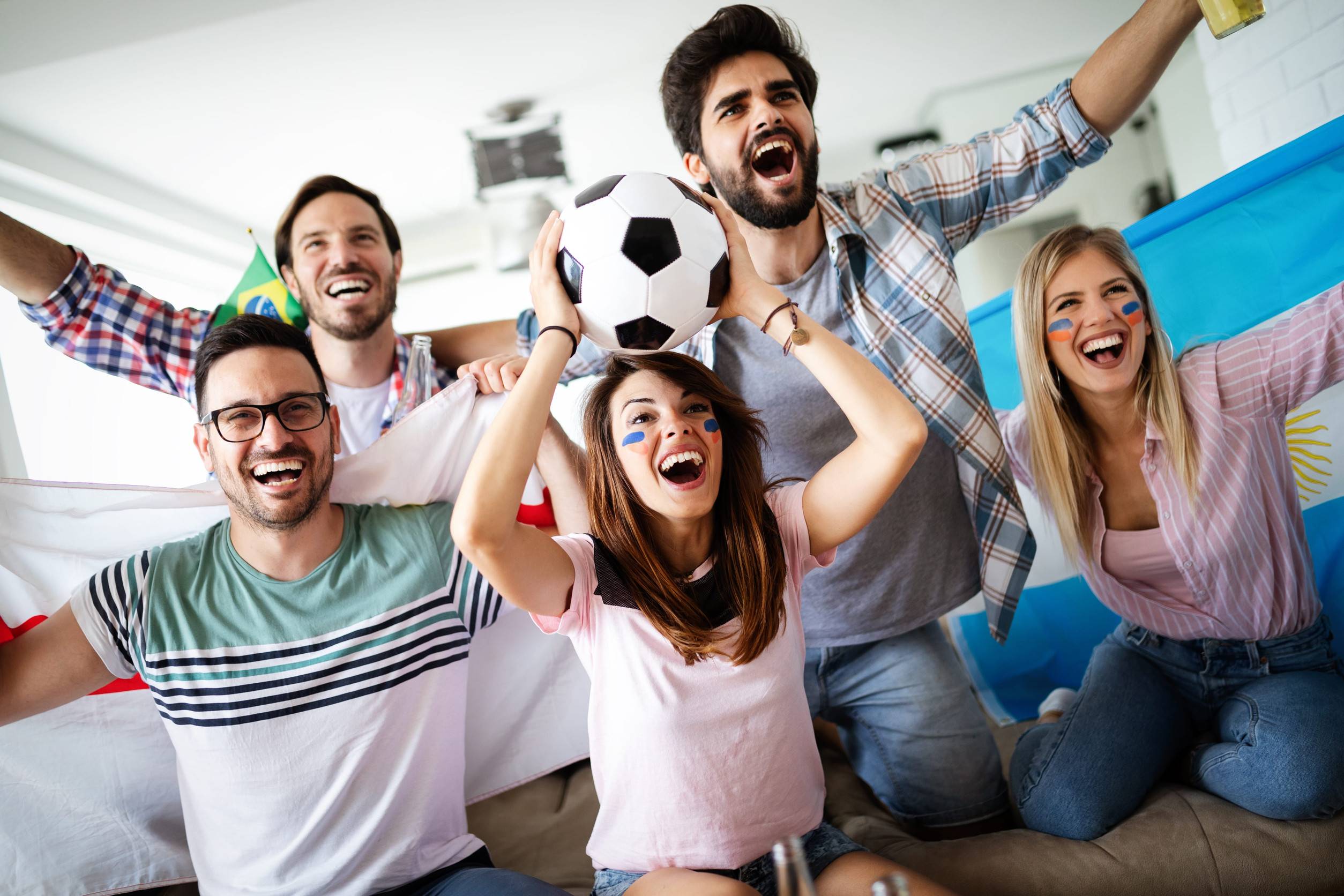 Young group of friends watching sports